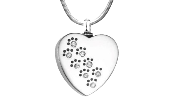 A heart shaped pendant with paw prints on it.